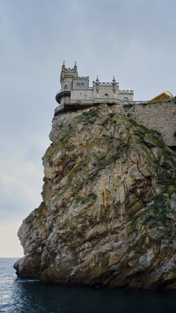 The rocky shore of the black sea in January. The famous place of Crimea Castle Swallowのeditorial素材