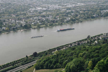 Shipping. Cargo barge. Magnificent panoramic view of the Rhine valley.  A beautiful landscape on a navigable river in Germanyのeditorial素材