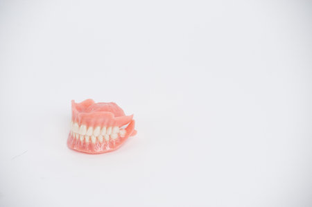 Dental prostheses on a white background. Beautiful teeth ceramic press ceramic crowns and veneers. Dental restoration treatment clinic patient. Oral surgery dentistの写真素材