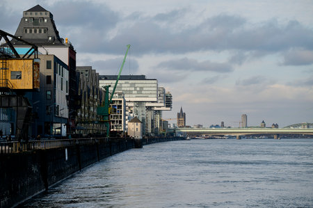 COLOGNE, GERMANY - 5 FEBRUARY, 2024: Rheinauhafen. Waterfront promenade with modern, dramatic buildingsのeditorial素材
