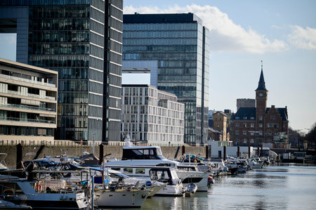 COLOGNE, GERMANY - 5 FEBRUARY, 2024: Rheinauhafen. Waterfront promenade with modern, dramatic buildingsのeditorial素材
