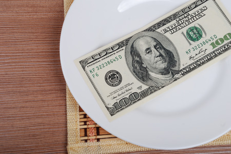 American US Dollar money on white plateの写真素材