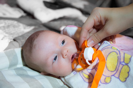 A cute newborn little baby girl with blue eyes  Use it for a child, parenting or love concept 