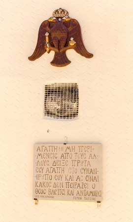 coat of arms and Greek religious symbol,plaque with the name on wall of  monastery in Crete, Greeceのeditorial素材