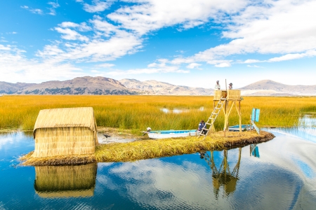  Floating  Islands on Lake Titicaca Puno, Peru, South America, thatched home. Dense root that plants Khili interweave form natural layer about one to two meters thick that support islandsの写真素材