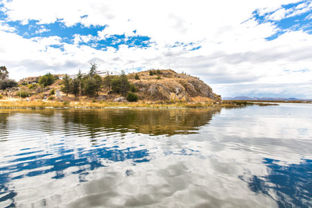 Lake Titicaca,South America, located on border of Peru and Bolivia  It sits 3,812 m above sea level, making it one of the highest commercially navigable lakes in the world の写真素材