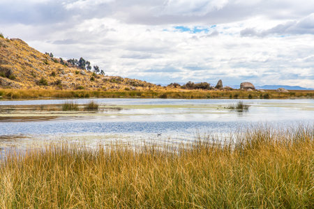 Lake Titicaca,South America, located on border of Peru and Bolivia. It sits 3,812 m above sea level,...