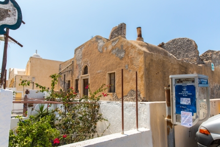 View of Fira town - Santorini island,Crete,Greece. White concrete staircases leading down to beautiful bay with clear blue sky and seaのeditorial素材