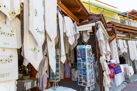 Traditional textiles on a market stall, colorful fabric, handmade souvenirs in Crite, Greeceのeditorial素材