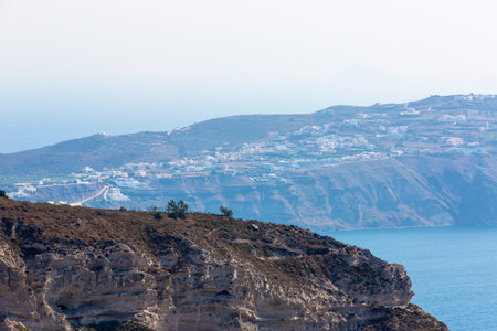 View of Fira town - Santorini island,Crete,Greece. Beautiful bay with clear blue sky and seaの写真素材
