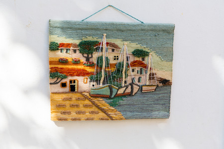 Traditional textiles on a market stall, colorful fabric, handmade souvenirs in Crite, Greeceの写真素材