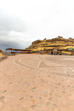Souvenir market near towers in Sillustani, Peru,South America. Street shop with colorful blanket, scarf, cloth, ponchos,ornamentsの写真素材