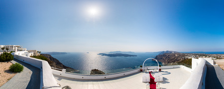 Panorama of  Fira town - Santorini island,Crete,Greece  White concrete staircases leading down to beautiful bay with clear blue sky and seaの写真素材