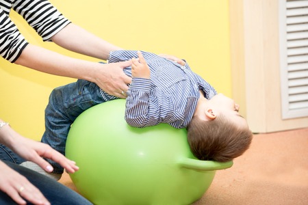Little child boy playing in kindergarten in Montessori preschool Class.の写真素材