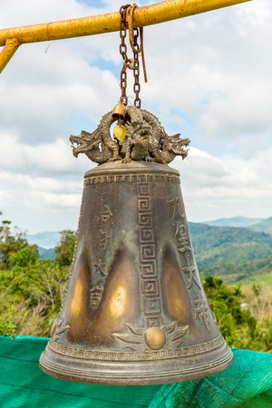 Tradition asian bell in Buddhism temple in Phuket island,Thailand. Famous Big bell wish near Gold Buddhaの写真素材