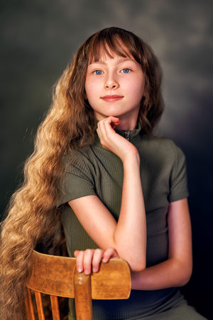 Portrait of a emotional beautiful girl kid isolated on black background. Teen girl in studio shot....