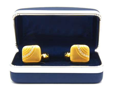 Vintage gold cufflinks with crystals in box isolated on white background