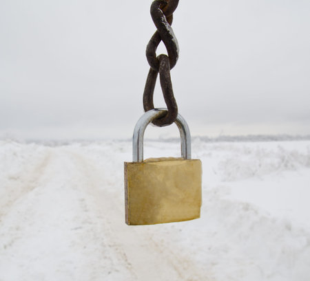 winter landscape and gold padlock whith chain
