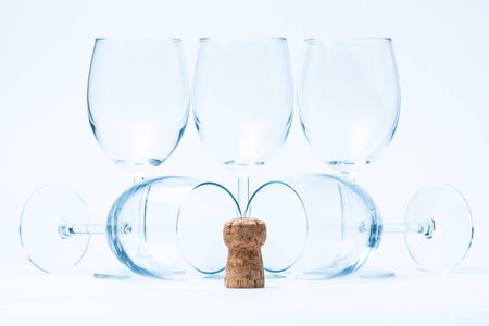 glass wine stand and lie symmetrically with corkの写真素材