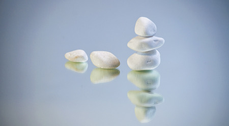 white stones placed on background, inspiration for peace and relaxation zenの写真素材