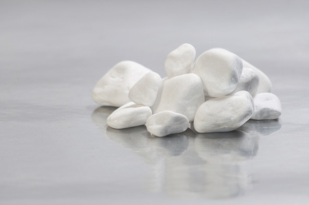 white stones placed on background, inspiration for peace and relaxation zenの写真素材