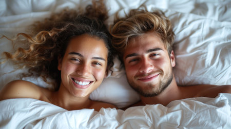 A man and a woman lying side by side in a bed.の素材