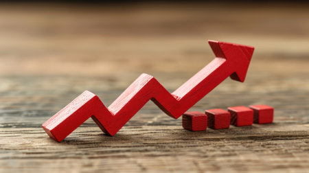 Red arrow pointing upward on wood.の素材