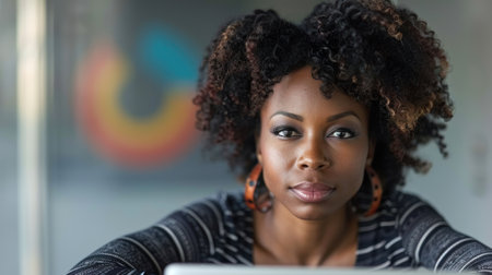 A woman with curly hair looks intently towards the camera, a determined expression on her face.の素材