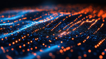 Bright blue and orange lights intertwine, forming a dynamic, flowing pattern in a dark digital environment.の素材