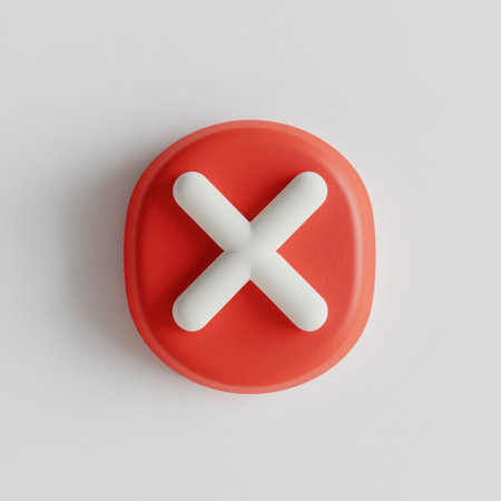 A vibrant red button displays a prominent white cross symbol, often used to signify cancellation or closing functions.の素材