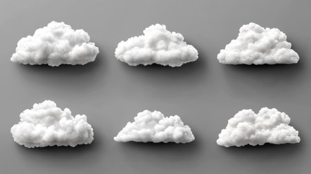 Fluffy white clouds are displayed on a gray surface, illustrating unique shapes and textures.の素材