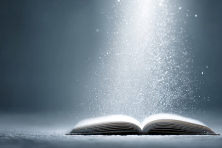 A book rests open as sparkling particles emerge from its pages creating an enchanting ambiance in low light.の素材