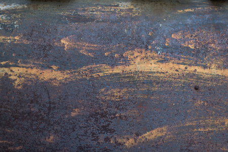 The flaking yellow color with scratched on the surface of rusty galvanized iron plate.の写真素材