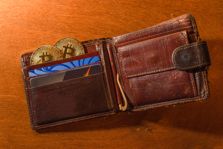 Purse with bitkoin and credit cards close-upの写真素材