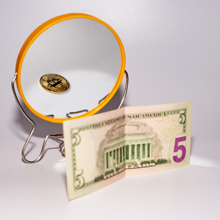 five dollar bill is reflected in the mirror.の写真素材