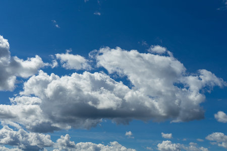 Cumulus clouds in a blue sky.