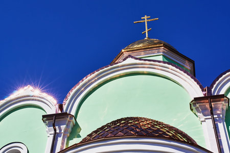 The top of the church shining in the sunの写真素材