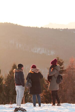 Group of kids on the snow in autumnの写真素材
