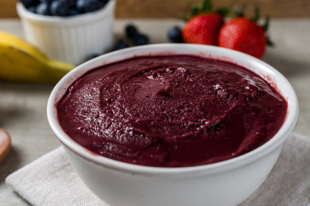 Brazilian frozen aÃ§ai berry ice cream bowl. with fruits on wooden background. Summer menu front view.の写真素材