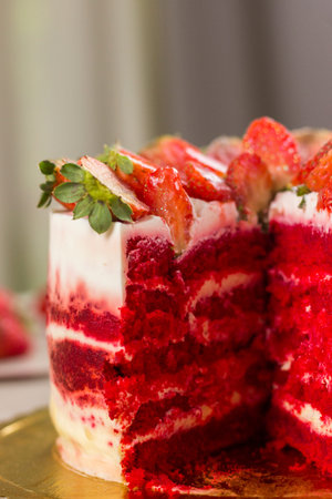 Red velvet cake on white wooden background. with strawberries.