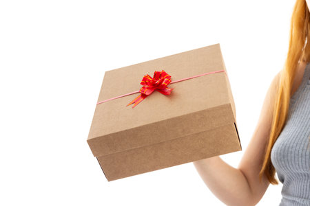 Valentines Day. Woman with gift box on white background.の写真素材