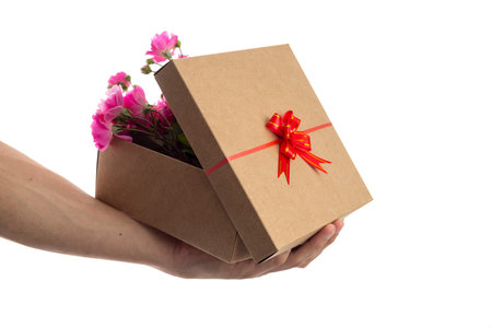 valentines day. a man opening a gift box full of flowers.の写真素材