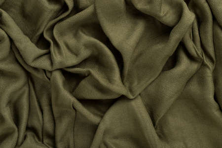 Crumpled linen cloth texture. Wrinkled textile. Green.の写真素材