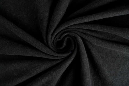 Crumpled linen cloth texture. Wrinkled textile. Dark black.の写真素材