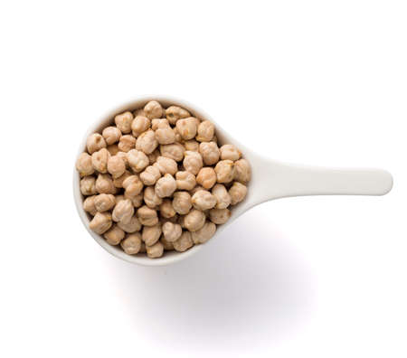 white cup full of chickpea isolated on white. Top view.の写真素材