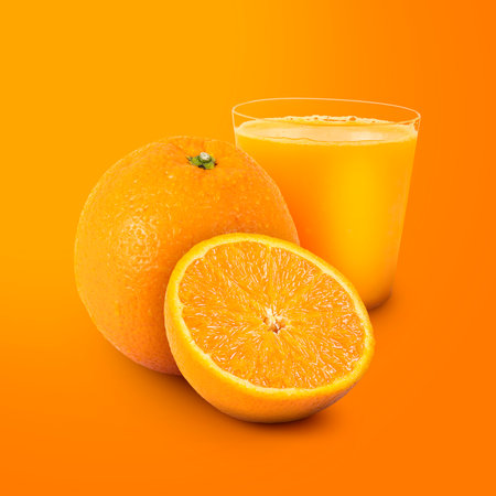 Orange Juice and Fruits Isolated on Orange Background.の写真素材