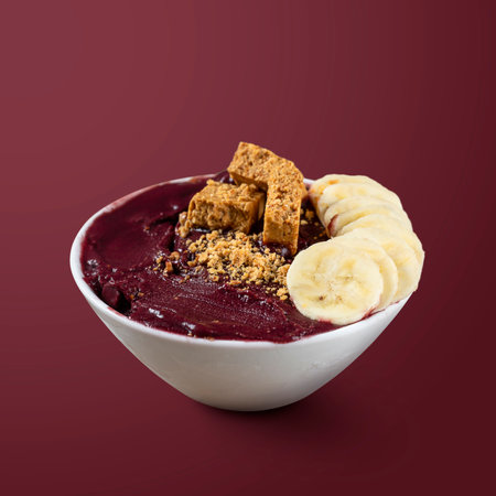 Frozen Acai Berry with Banana and Pacoca. Isolated on Purple Background.の写真素材