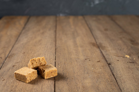 Stack of Brazilian Peanut Sweet called paÃ§oca on a wooden desk.の写真素材