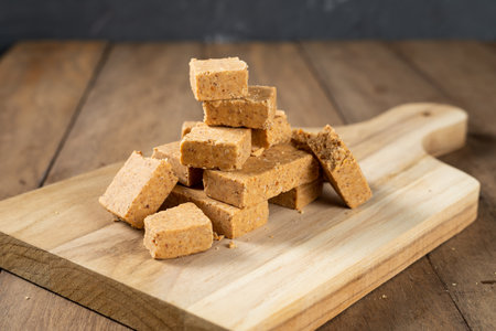 Stack of Brazilian Peanut Sweet called paÃ§oca on a wooden desk.の写真素材