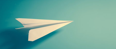 Paper plane on blue background with copy space. 3D rendering.の素材